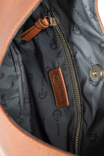 Close-up of smooth leather texture  and interior detail on hobo bag