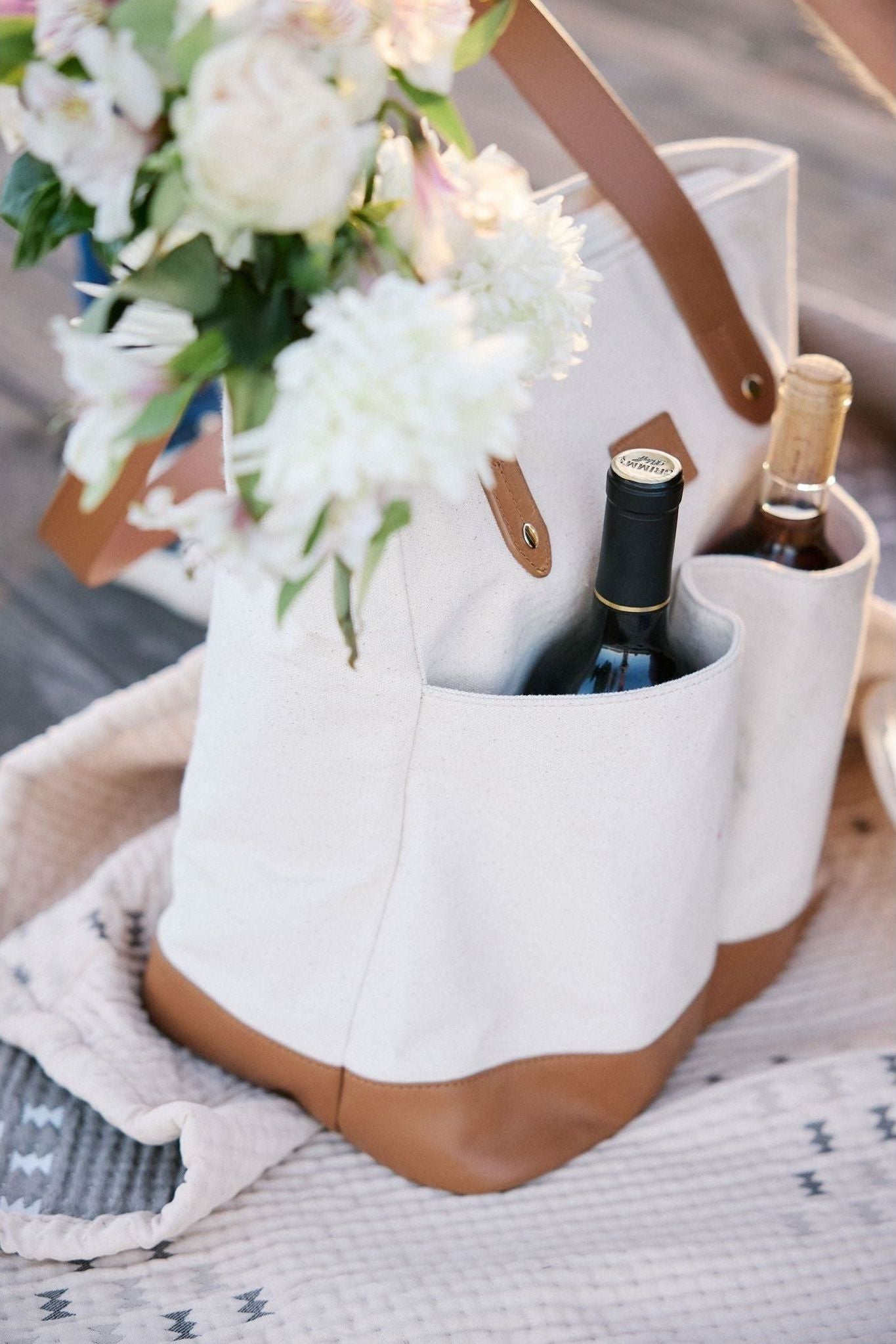 Ivy Cove Ojai wine picnic bag packed with bottles and flowers — 4 bottle insulated wine carrier