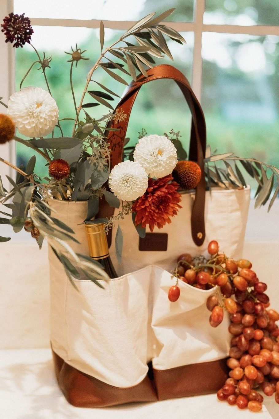 Ivy Cove Ojai wine bag with 4 exterior bottle pockets filled — canvas and leather wine carrier