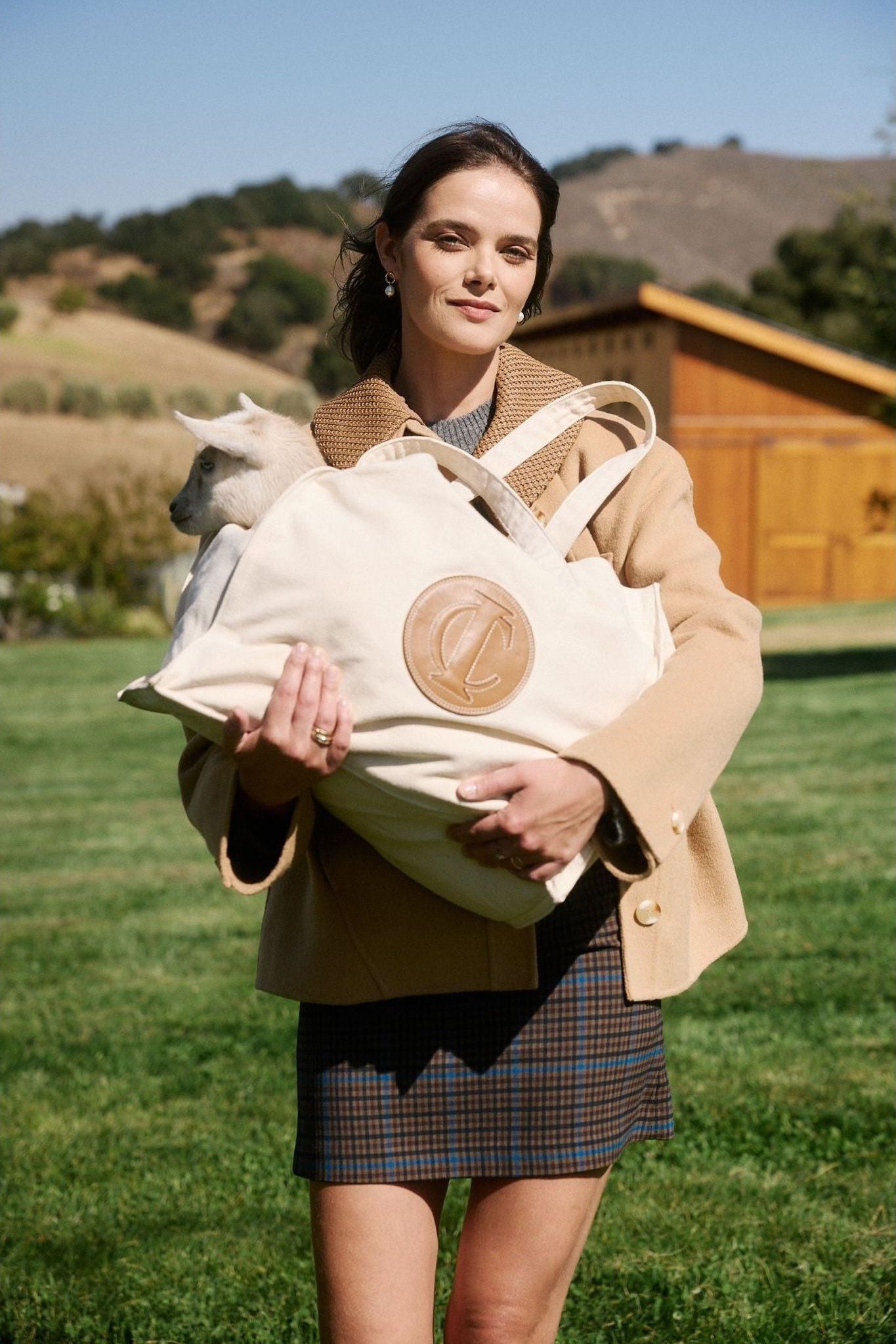 Natural canvas market tote in field with goat