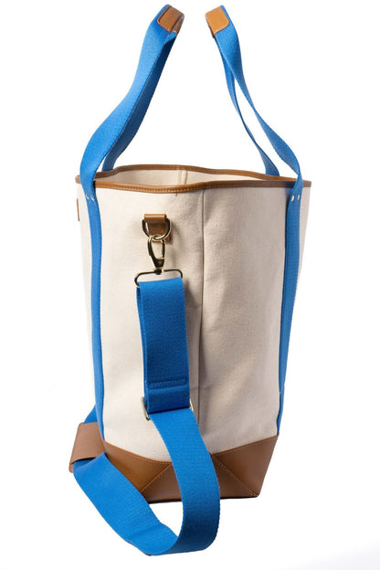 Close-up of Ivy Cove Saltwater Tote Cobalt stripe handle and canvas construction with leather trim